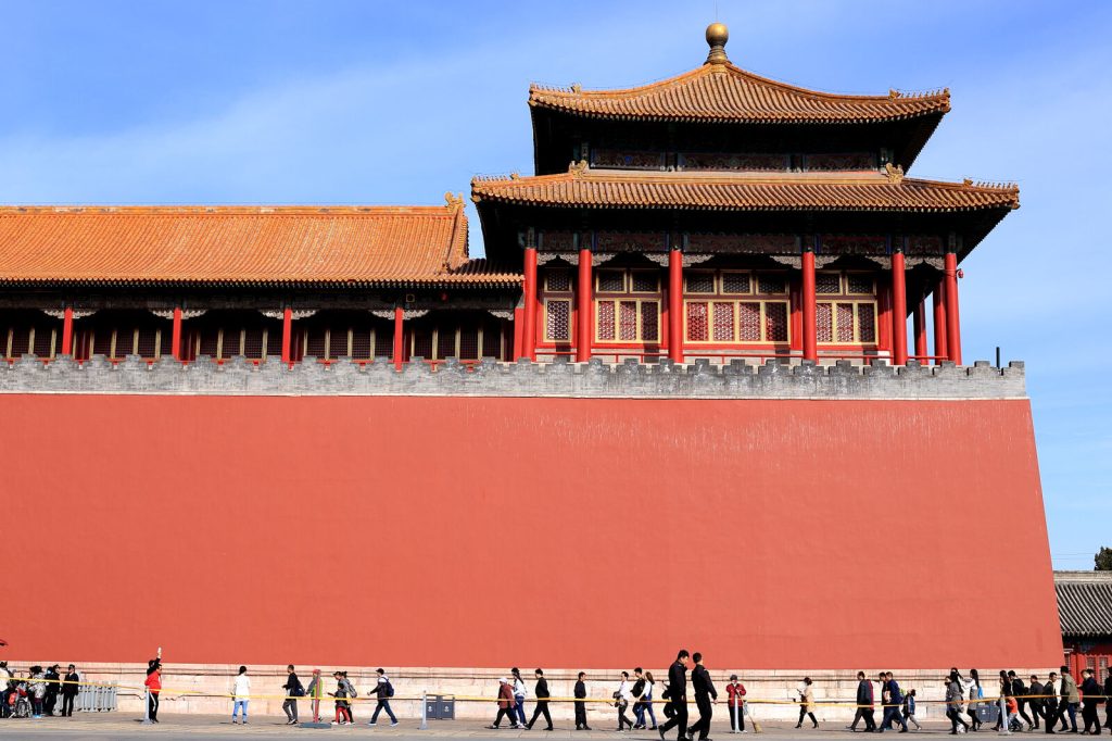Visitors moving beside the Meridian Gate wall at the Forbidden City