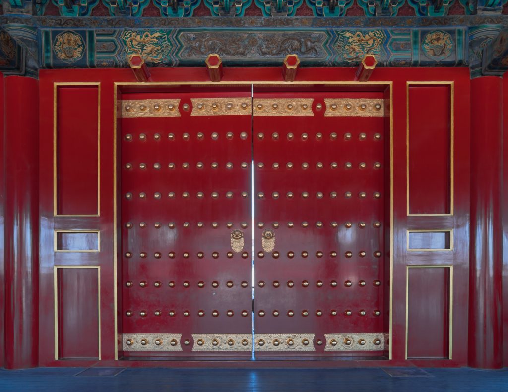 Side angle inside the Forbidden City with palace architecture and open paving