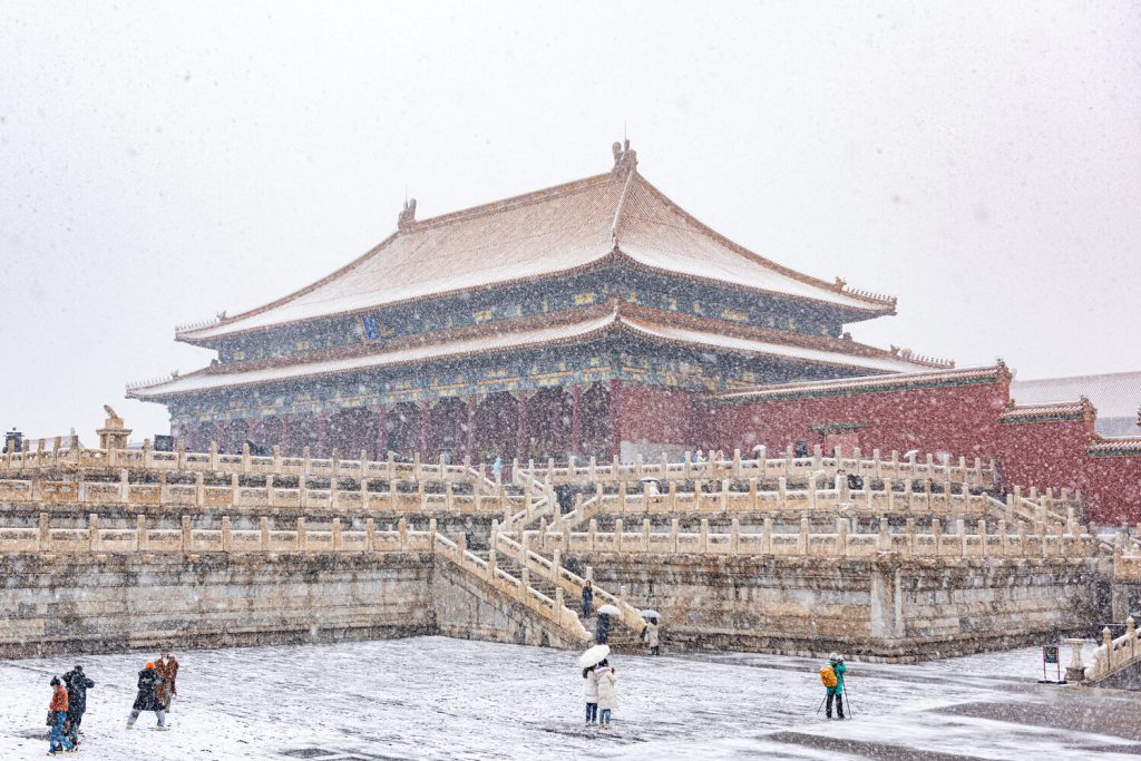 Hall of Supreme Harmony courtyard during snowfall at the Forbidden City