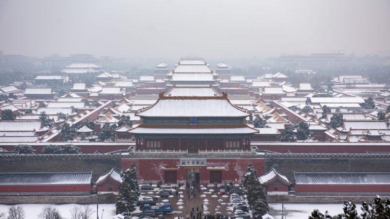 Snow-covered Forbidden City roofs seen from Jingshan Park in winter