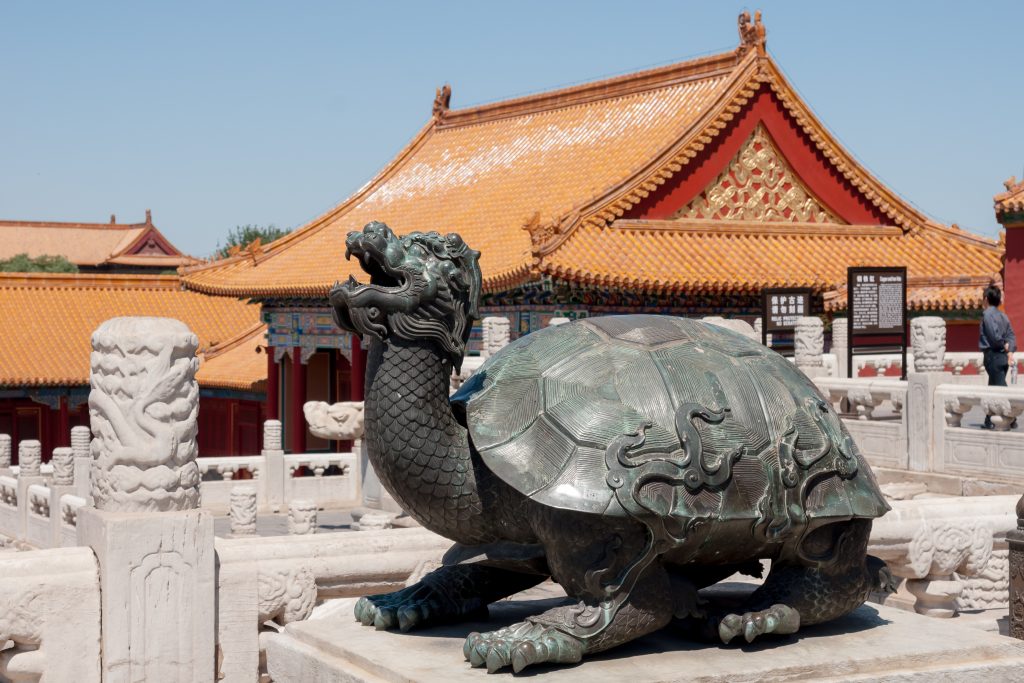 Large Forbidden City courtyard with palace hall and visitors