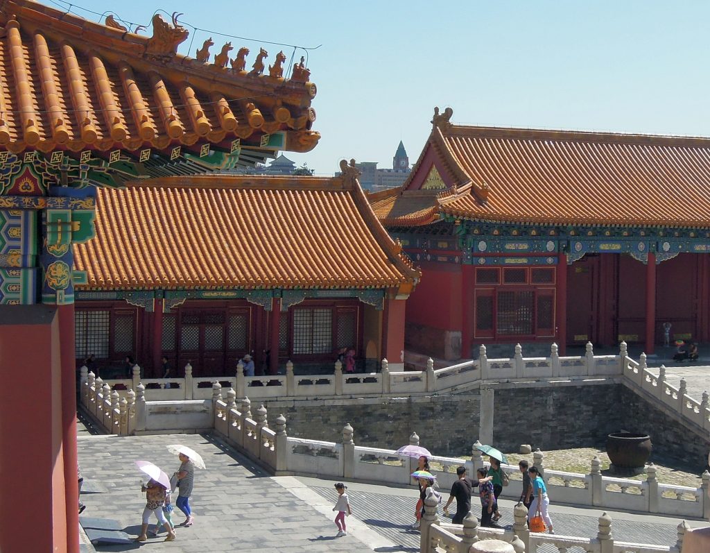 Mythical animal figures along a Forbidden City palace roof