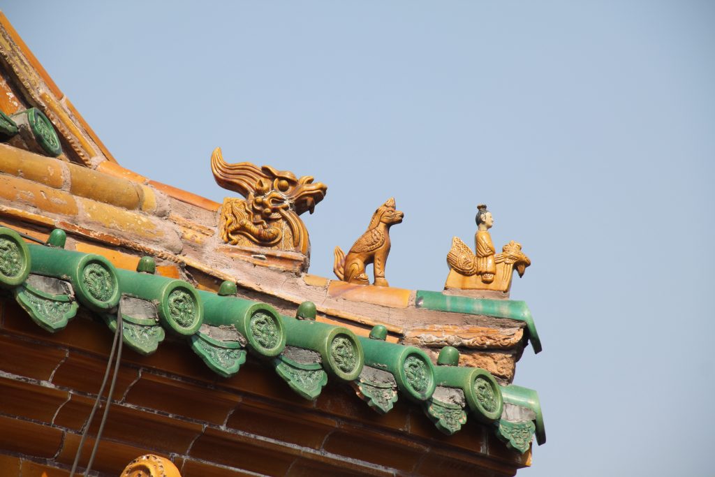 Decorative roof figures on a Forbidden City building