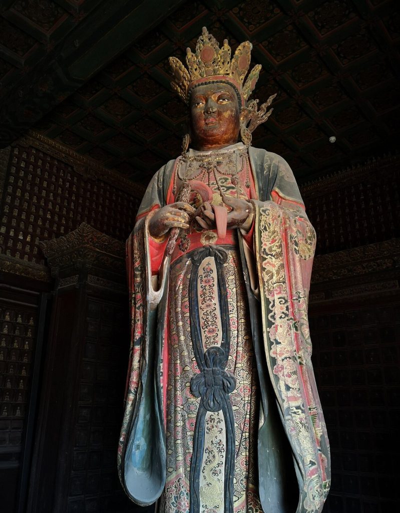 Painted Ming dynasty statue of Brahma inside Zhihua Temple in Beijing