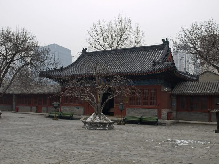 Red wooden Eastern Hall and courtyard at Zhihua Temple in Beijing