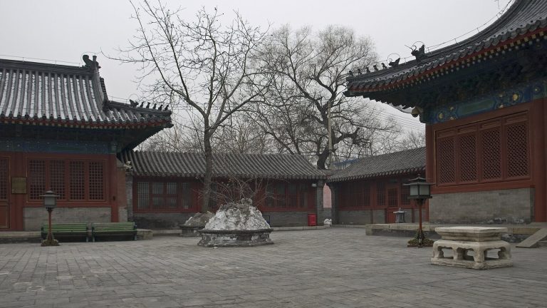Quiet central courtyard with red halls at Zhihua Temple in Beijing