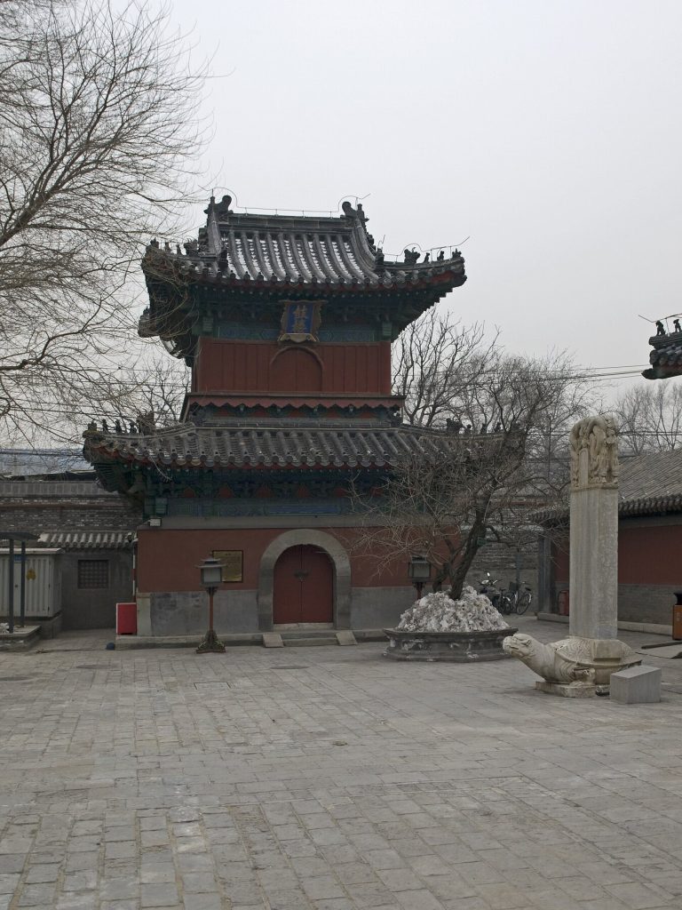 Two-level red tower with a round arch at Zhihua Temple in Beijing