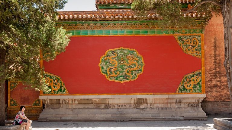 Red wall with glazed tile decoration in the Forbidden City