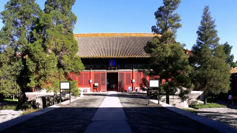 Wenhua Hall exterior framed by trees, historical photograph